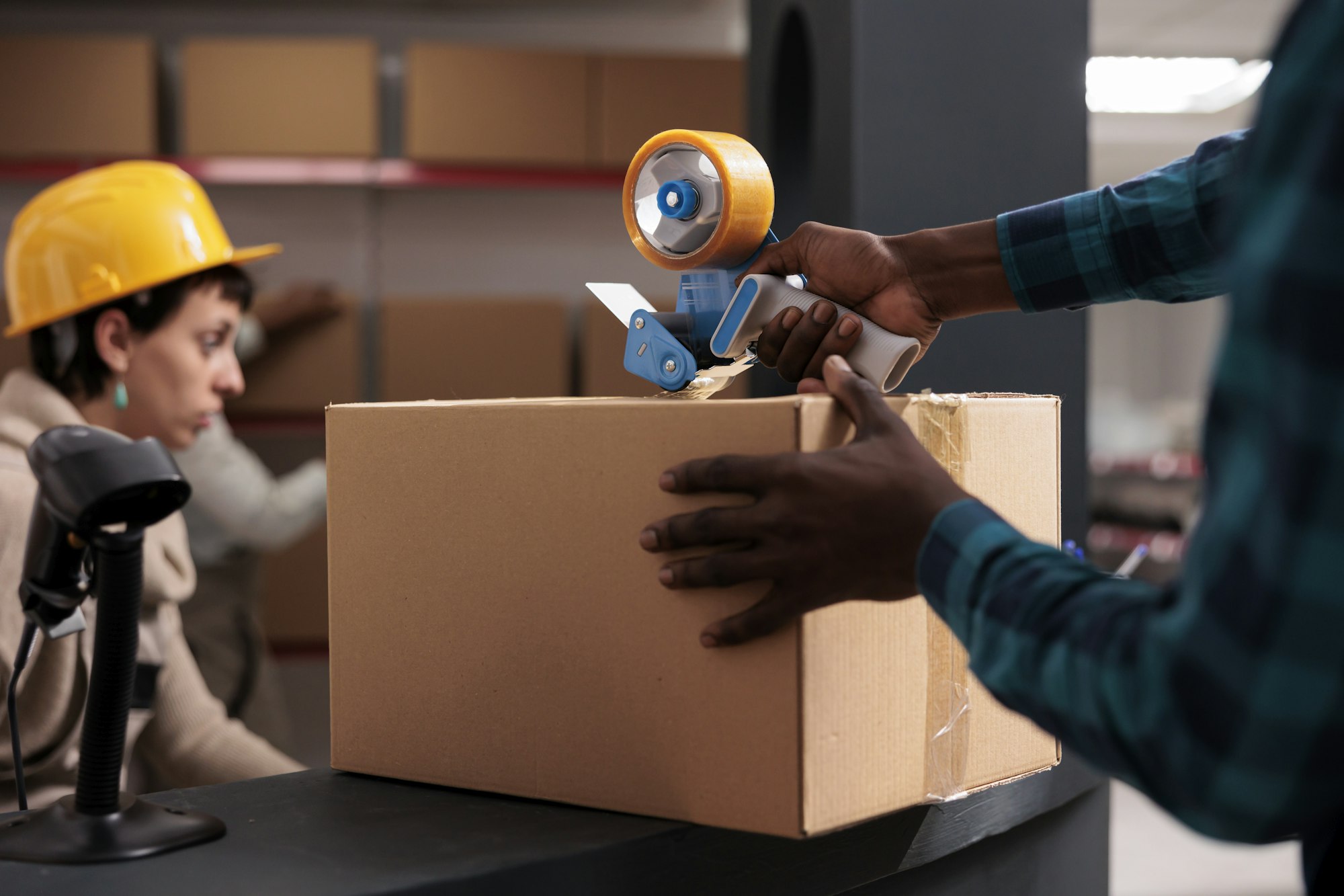 Factory warehouse worker packing freight for transportation