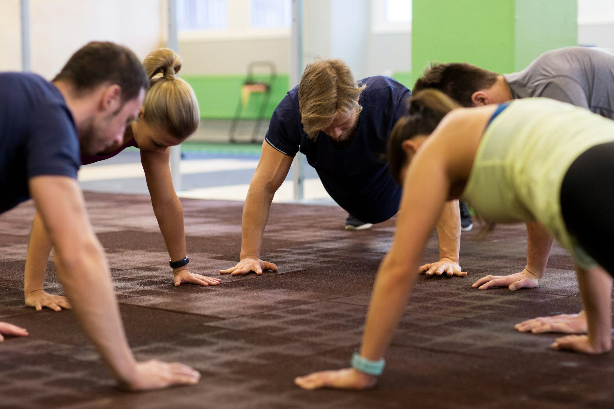 group of people exercising in gym