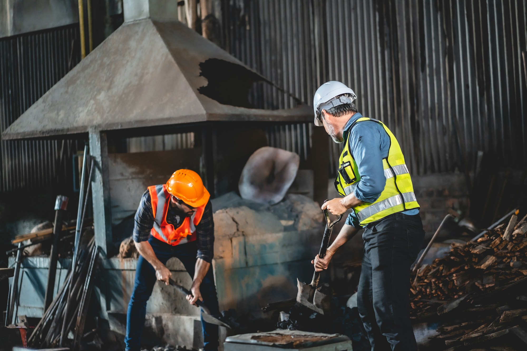 Mine worker man dressed in work overalls and a hard hat, Work in a coal mine, Plant worker