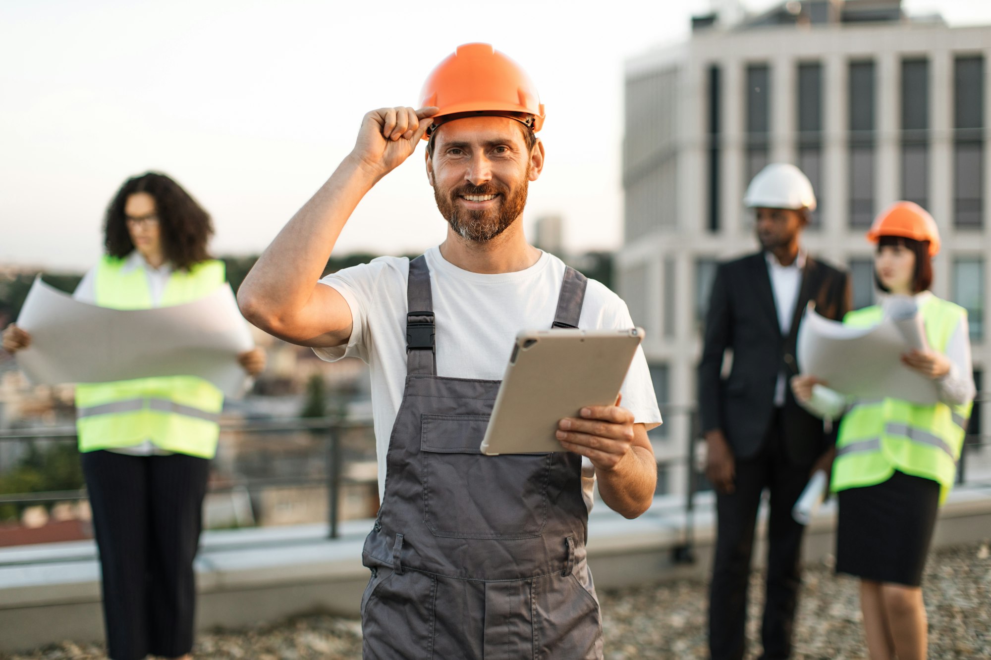 Multiracial team of builders attending construction site