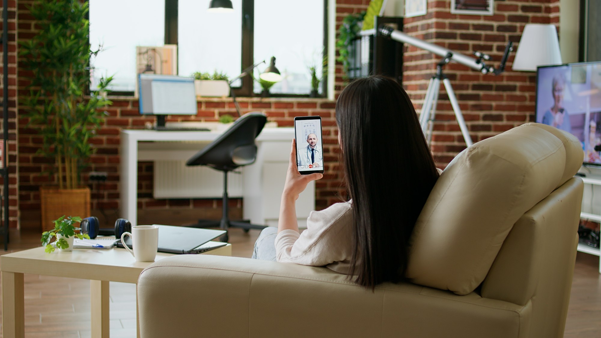 Patient getting virtual consultation through telehealth program while talking with doctor